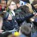 An audience member takes a photo of herself as she wait with 3,000 others for President Obama's speech at the Al Glick Fieldhouse on Friday morning.  Melanie Maxwell I AnnArbor.com